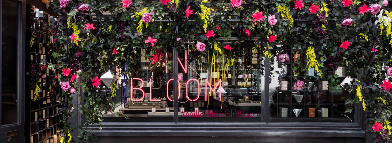 Landscape shot of Covent Garden In Bloom sign as part of Prop Studios' window design for Miller Harris